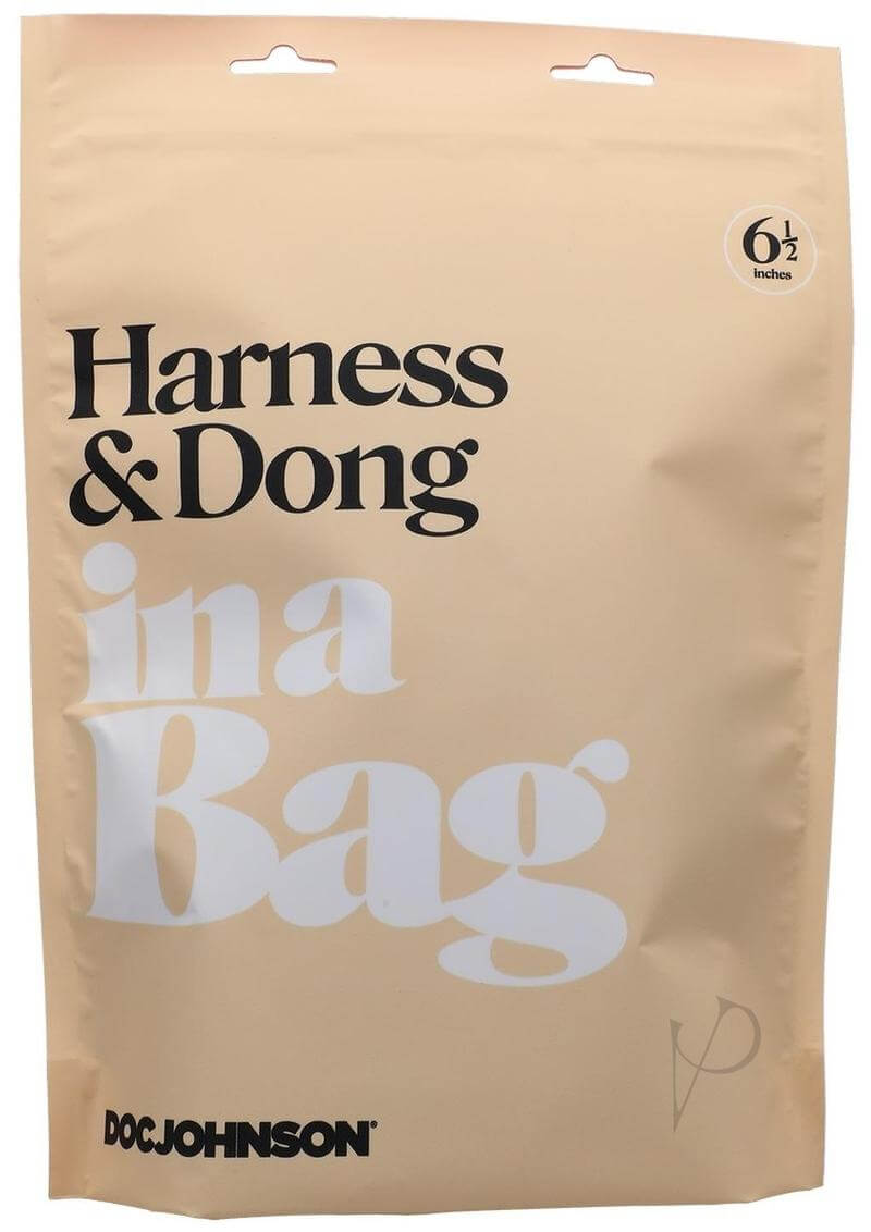 In A Bag Black Harness with Slim Silicone Dong packaging in beige bag with product details and brand logo