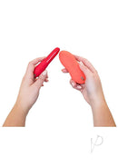 Person holding the We-Vibe Forever Favorites Set, featuring Tango X and Touch X vibrators in red and coral colors.