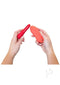 Person holding the We-Vibe Forever Favorites Set, featuring Tango X and Touch X vibrators in red and coral colors.