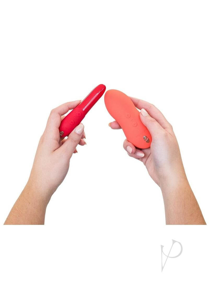 Person holding the We-Vibe Forever Favorites Set, featuring Tango X and Touch X vibrators in red and coral colors.