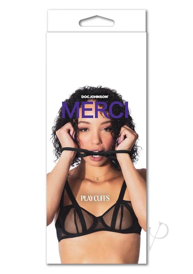 Merci Play Cuffs Black packaging featuring model holding silicone restraints in front of face