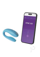 Turquoise We-Vibe Sync Go couples vibrator with control app on smartphone screen.