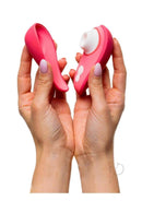 Woman holding Womanizer Liberty 2 Vibrant Rose with magnetic cover displayed