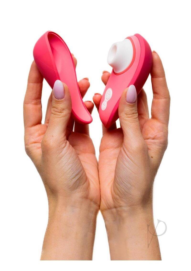 Woman holding Womanizer Liberty 2 Vibrant Rose with magnetic cover displayed