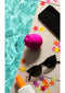 We-Vibe ROMP Rose Pink clitoral stimulator by the pool with sunglasses and scattered stars.