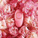 ZALO Jeanne Rouge Pink app-controlled rechargeable massager on a bed of pink flowers, inspired by Versailles luxury and elegance.