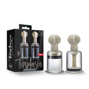 Temptasia Clitoris and Nipple Large Twist Suckers Set with packaging and two clear suction cylinders.