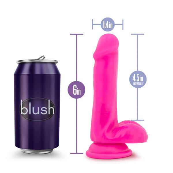Au Naturel Bold Delight 6-inch pink dildo next to a soda can for size comparison, showcasing its realistic design and suction cup base.