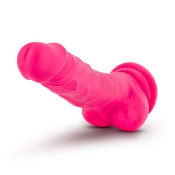 Neo Elite 7.5-inch neon pink silicone dildo with balls and suction cup base from Blush Novelties.