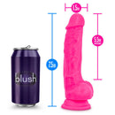Neon pink 7.5 inch silicone dual density dildo with balls and suction cup base, shown next to a can for size comparison.