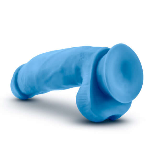 Neo Elite 7 inches silicone dual density cock with balls in neon blue from Blush Novelties, featuring lifelike sculpting and suction cup base