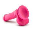 Neo Elite 6-inch silicone dual density dildo with balls in neon pink from Blush Novelties, featuring a suction cup base.