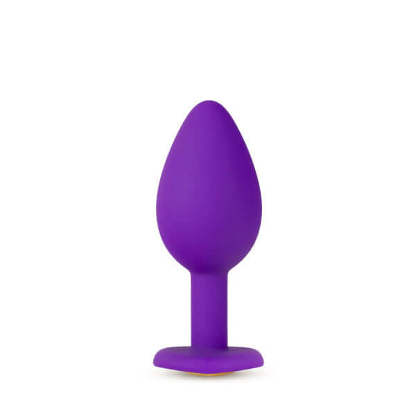 Temptasia Bling Plug Small Purple with heart-shaped base and gold faux gemstone, made of platinum cured silicone by Blush Novelties.