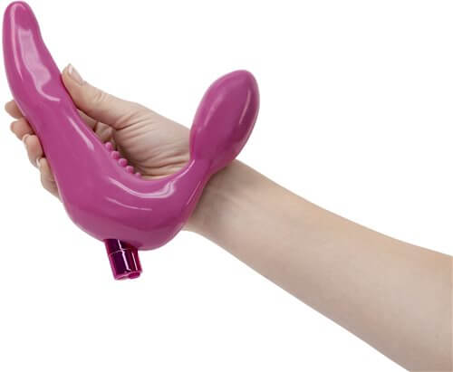 Rechargeable Infinity Strapless Strap On in hand, pink vibrating toy designed for ultimate pleasure and waterproof versatility.