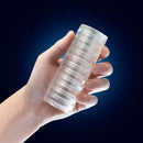 Rize Ribz Glow In The Dark Self Lubricating Stroker Clear held in hand displaying ribbed texture by Blush Novelties
