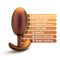 Anal Adventures Matrix Neutron Plug in Cosmic Copper, highlighted features including Puria silicone, Ultrasilk smooth, motion activated, Stayput design