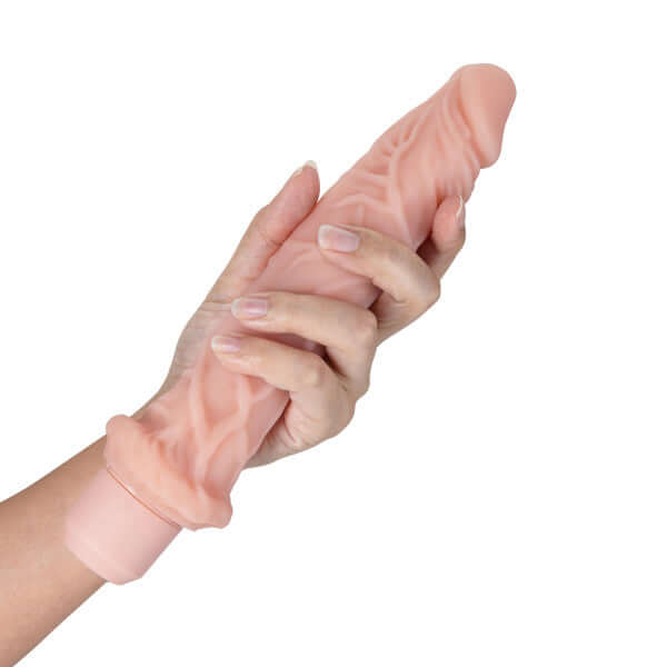 Hand holding Dr. Skin Silicone Dr. Richard 9-inch Vibrating Dildo with Flexishaft Technology for ultimate pleasure.