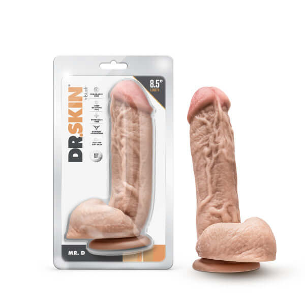 Dr. Skin Mr. D 8.5 inches beige dildo with balls and suction cup base in packaging and displayed outside the packaging.
