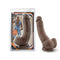 Chocolate brown Loverboy The Mechanic dildo with ultra-realistic design in packaging.