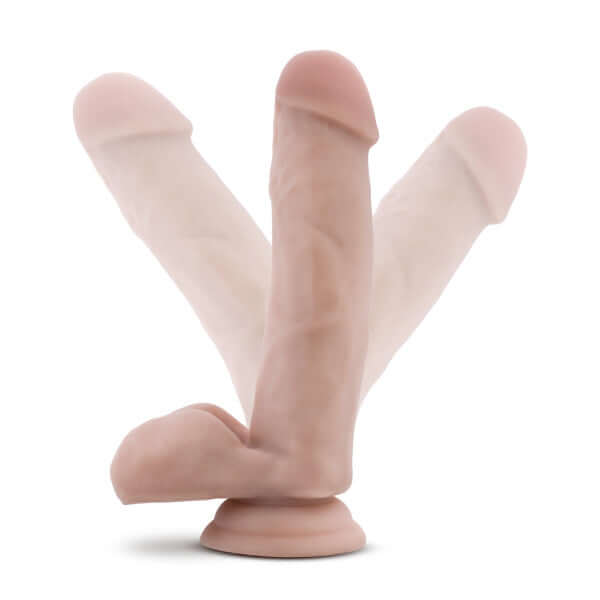 Realistic 7 inch tan dildo with balls, harness compatible and suction cup base by Dr. Skin, shown in different positions for flexibility