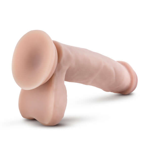 Realistic 7 Inch Tan Dildo with Balls by Dr. Skin featuring harness compatibility and sturdy suction cup base for hands-free play.