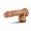 Dr. Skin Dr. Mark 7 inches dildo with balls in tan medium skin tone with suction cup base from Blush Novelties lies on a smooth surface.