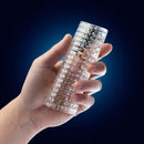 Close-up of hand holding the Rize Strokerz Clear Male Masturbation Sleeve by Blush Novelties, showcasing its textured and stimulating design.