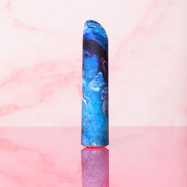 Limited Addiction Mesmerize Power Vibe Azure from Blush Novelties on a pink background