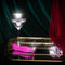 Pink Oh My Gem Exclusive Tourmaline Vibrator displayed on elegant tray with glass and gems