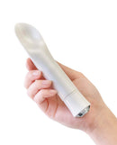 Hand holding Oh My Gem Bold Diamond Silver Vibrator from Blush Novelties with scooped shape for enhanced pleasure.