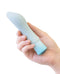Hand holding Oh My Gem Ardor Aquamarine Blue Rechargeable Vibrator with tapered end and bulbous head for internal and external stimulation.
