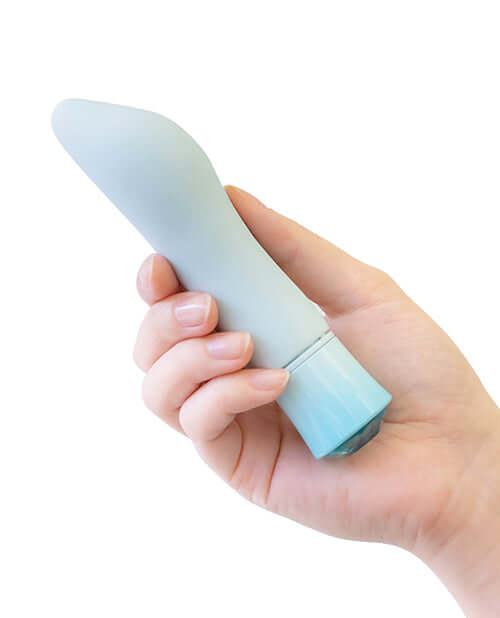Hand holding Oh My Gem Ardor Aquamarine Blue Rechargeable Vibrator with tapered end and bulbous head for internal and external stimulation.