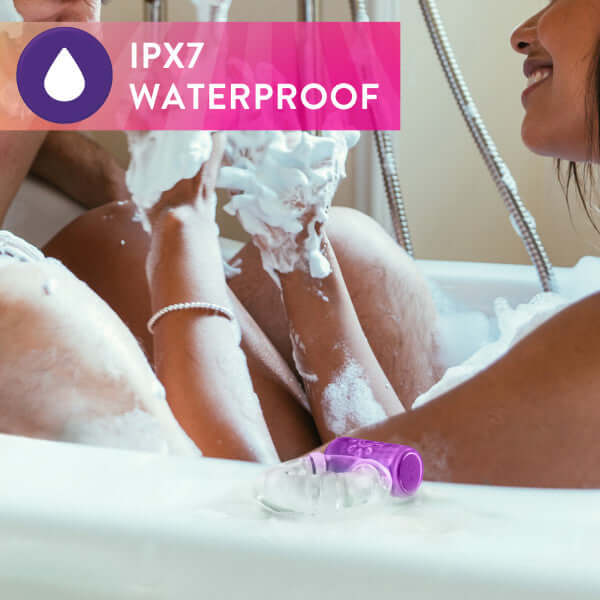 Couple enjoying a bath with Play With Me Pleaser Rechargeable C-Ring - Purple, showing IPX7 waterproof feature.