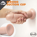 Dr. Skin Glide 8 inches Self Lubricating Dildo Vanilla Beige with strong suction cup being held in hand