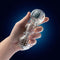 Hand holding Rize Feelz Clear Male Masturbator with textured translucent compartments for enhanced pleasure from Blush Novelties.