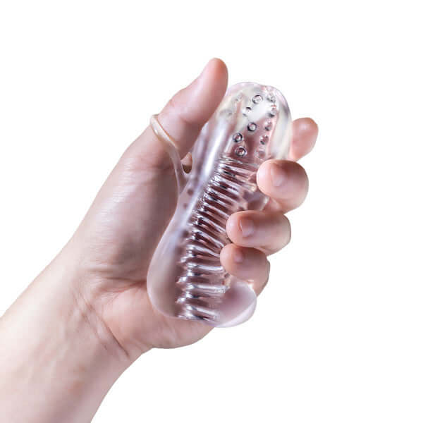 Hand holding Rize Squeezy Clear Male Masturbator from Blush Novelties featuring multi-textured chambers and clear design.