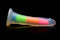 Lollicock 7 inches Glow In The Dark Rainbow Silicone Dildo by Curve Toys on black background