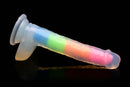 Lollicock 7" glow in the dark rainbow silicone dildo with balls on black background