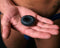 "Perfect Fit Ribbed Ring Ice Black cock ring in hand, showcasing ribbed texture for enhanced pleasure and performance."
