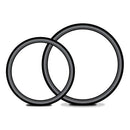 Two black silicone O-rings in different sizes for strap-on harness compatibility.