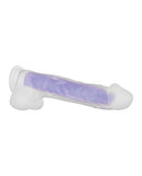 Glowing dual-layer silicone dildo with lifelike details and suction cup, designed for an illuminated pleasure experience.