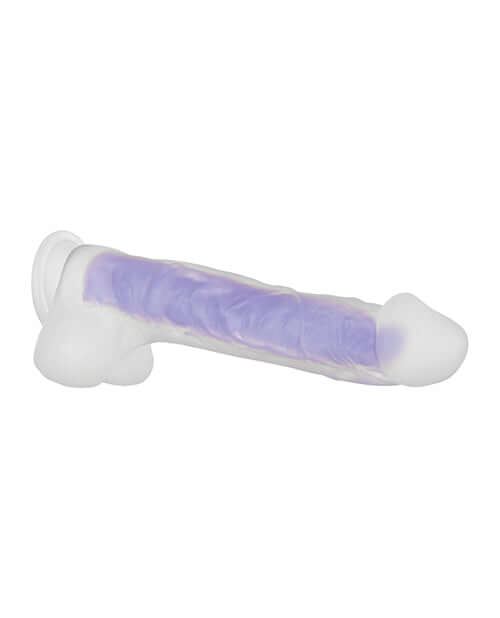 Glowing dual-layer silicone dildo with lifelike details and suction cup, designed for an illuminated pleasure experience.