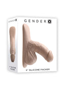 Gender X 4-Inch Silicone Packer in light skin tone packaging, realistic and body-safe design.
