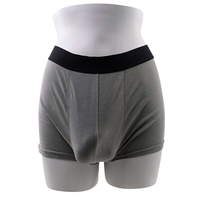 Gender X 4-Inch Silicone Packer shown in grey underwear, showcasing realistic and flexible design for body-safe everyday wear.