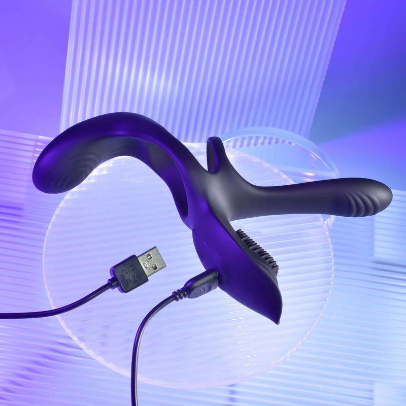 Playboy The 3 Way Vibrating Cock Ring in sleek black design, showcasing USB charging feature against a vibrant purple backdrop.