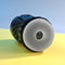 Playboy Solo Stroker by Evolved Novelties with soft textured channel shown on yellow surface