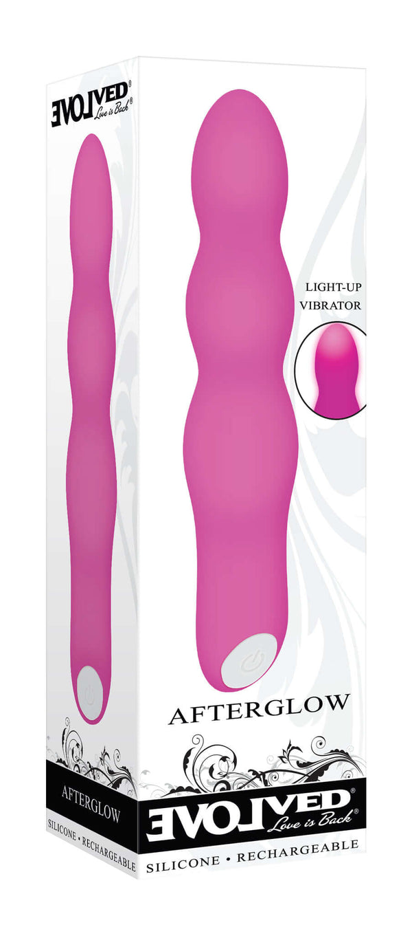 Evolved Afterglow Pink Light-Up Vibrator in its packaging displaying curvy design and light-up feature.
