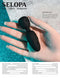 Black Selopa Buzz One Out Massager in hand with water droplets, featuring flexible round head and textured handle for intimate pleasure.