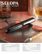 Selopa Buzz Buddy dual-ended bullet vibrator with lipstick-shaped and rounded tips on a tray, elegant black chrome finish
