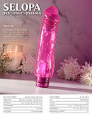 Selopa Thicc Boi Realistic Pink Vibrator with lifelike textures and powerful sensations placed on a table with flowers in the background